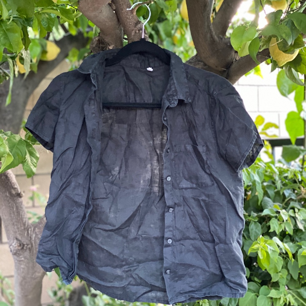 Black button up shirt.